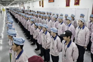 Employees being hired in a manufacturing facility